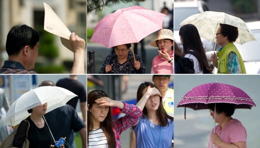 서울 광화문에서 시민들이 높아진 가을 자외선 지수에 양산과 서류, 손 등으로 얼굴을 가리고 걸음을 재촉하고 있다. /사진제공=뉴스1 이명근 기자