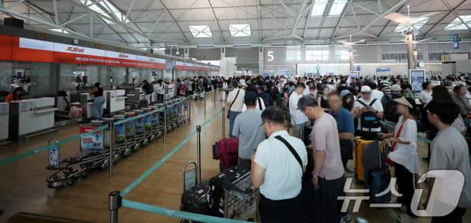 [사진] 시스템 복구는 했지만 '길게 늘어선 줄'