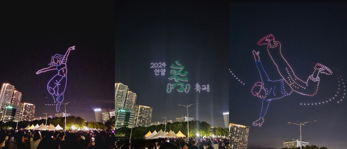 안양춤축제가 지난 27일 19시 평촌중앙공원과 삼덕공원에서 개막했다. 평촌중앙공원 개막식 마지막 무대로 펼쳐진 가을 밤하늘의 ‘드론라이트쇼’를 시민들이 감상하고 있다. / 사진제공=안양시